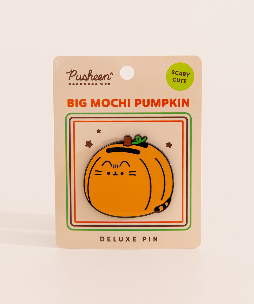 Big Mochi Pumpkin Pusheen Pin on a orange backer card. The deluxe pin shows Pusheen as an oversized pumpkin with a brown stem and green vine.
