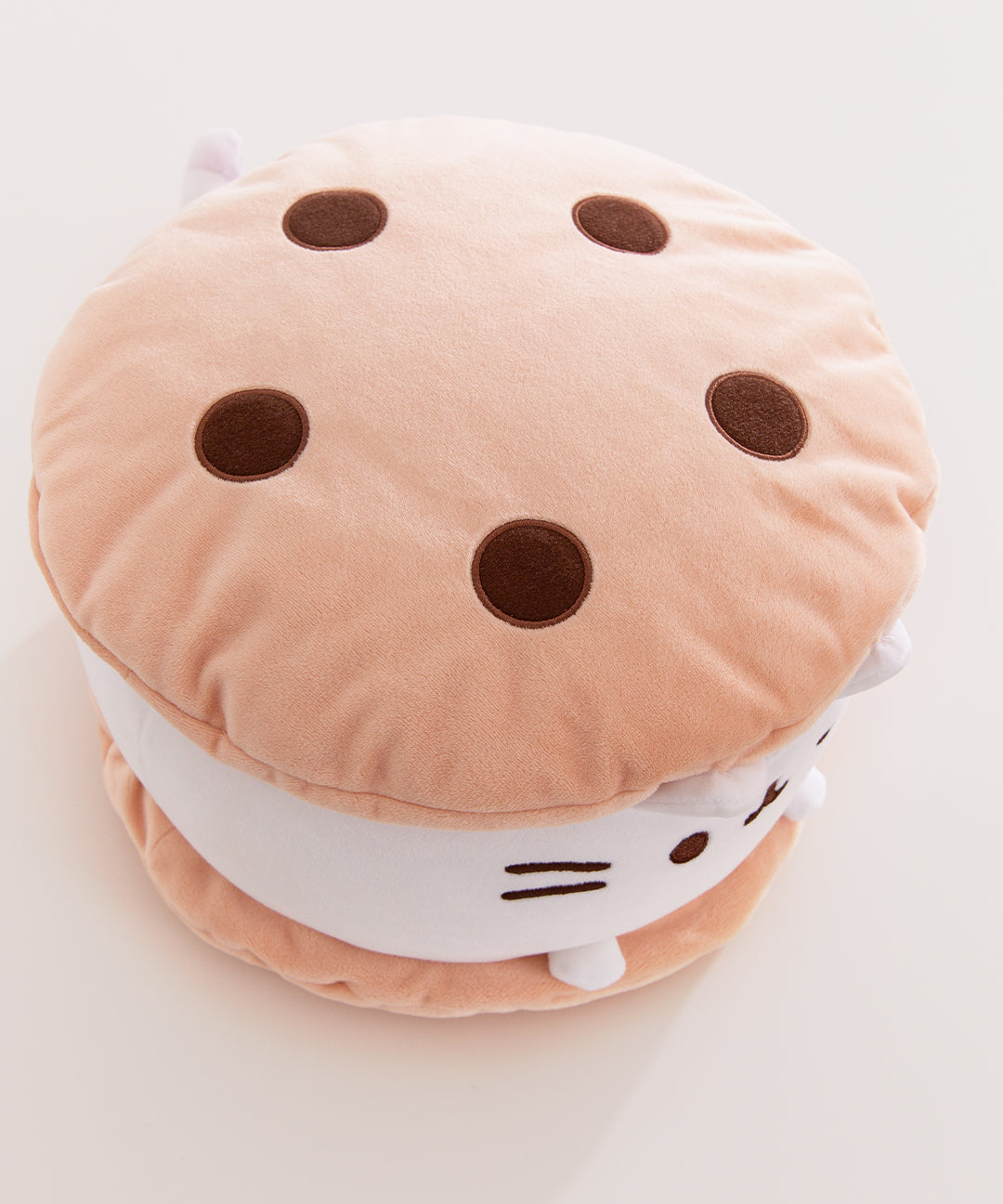 Top view of the Ice Cream Cookie Sandwich Plush that shows the top cookie has chocolate chip details.
