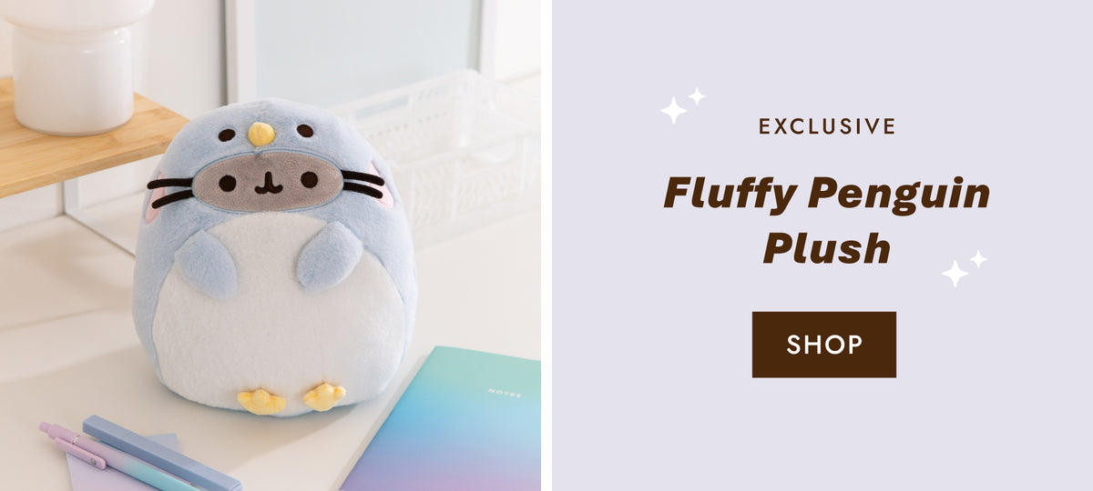 Pusheen dressed as a light blue and white fluffy penguin with yellow beak and feet