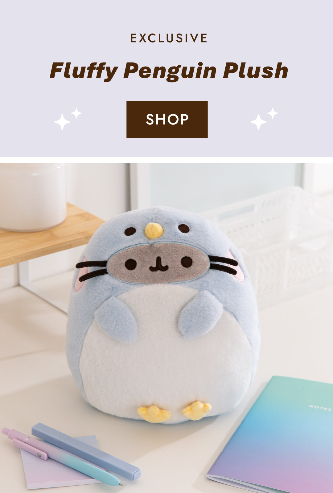 Pusheen dressed as a light blue and white fluffy penguin with yellow beak and feet