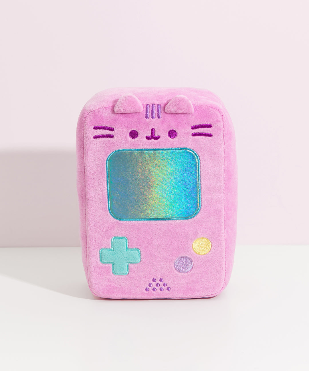 Front view of the Gamer Pusheen Handheld Console Plush. Pusheen the Cat takes the form of a pink retro gaming console with a reflective blue screen, blue, yellow, and purple buttons. 