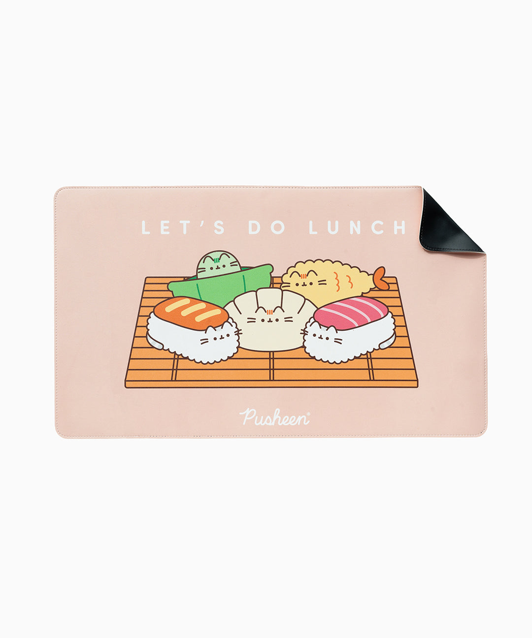Front view of the Pusheen Bento Desk Mat. The pink desk mat has one corner curled-up to show the non-slip backing material. The front of the desk mat features a graphic of Pusheen as various bento box items and includes the phrase "let's do lunch".