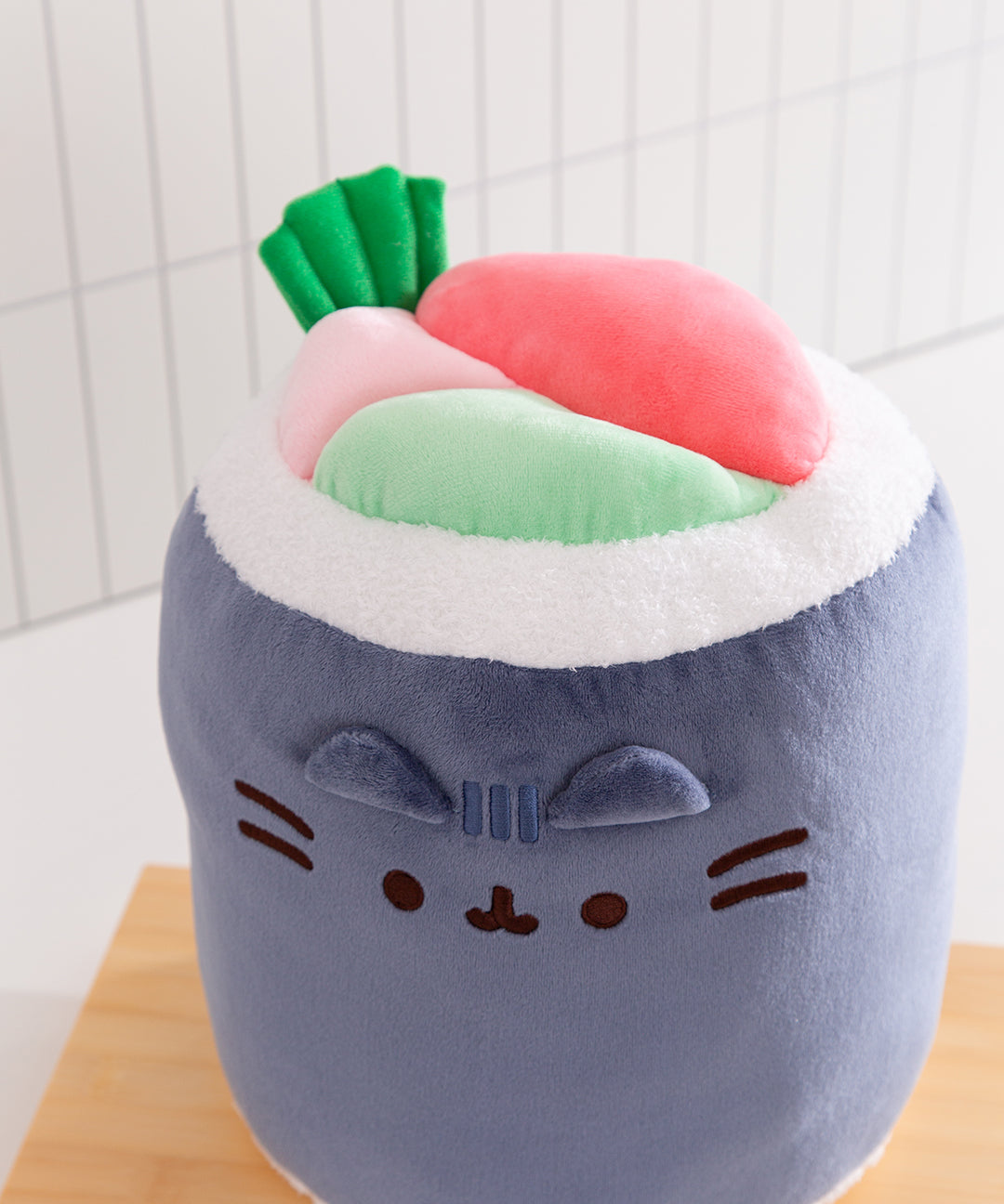 Close-up of the green and pink "fillings" of the plush Sushi Roll. 