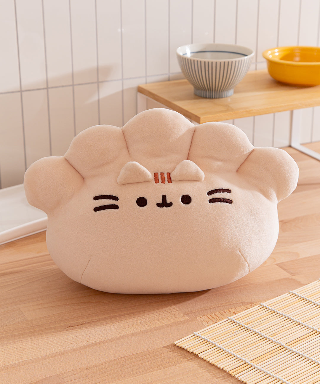 Front view of the Pusheen Gyoza Squisheen Plush where Pusheen the Cat takes the form of a plump white dumpling.