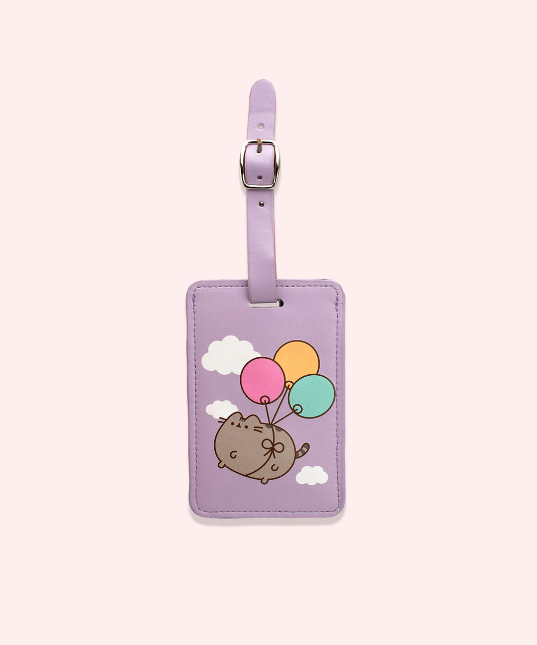 Pusheen Luggage Tag showcases a graphic of Pusheen attached to three balloons floating through the clouds. The luggage tag is rectangular and has an adjustable buckle.