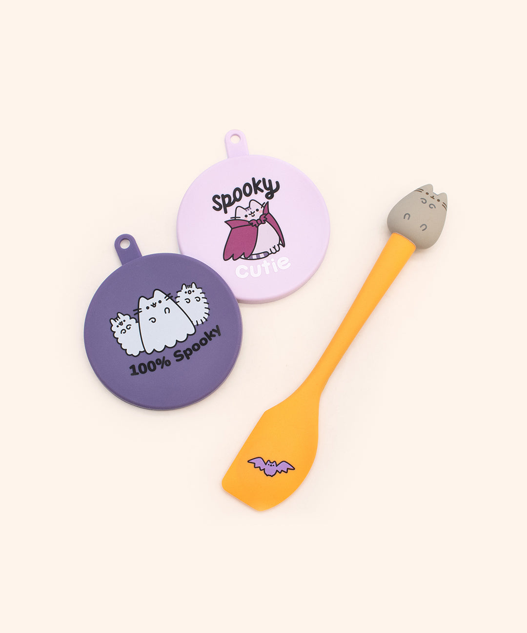 Pusheen Pet Halloween Can Cover and Spoon Set includes two silicone can food covers and a small spatula.