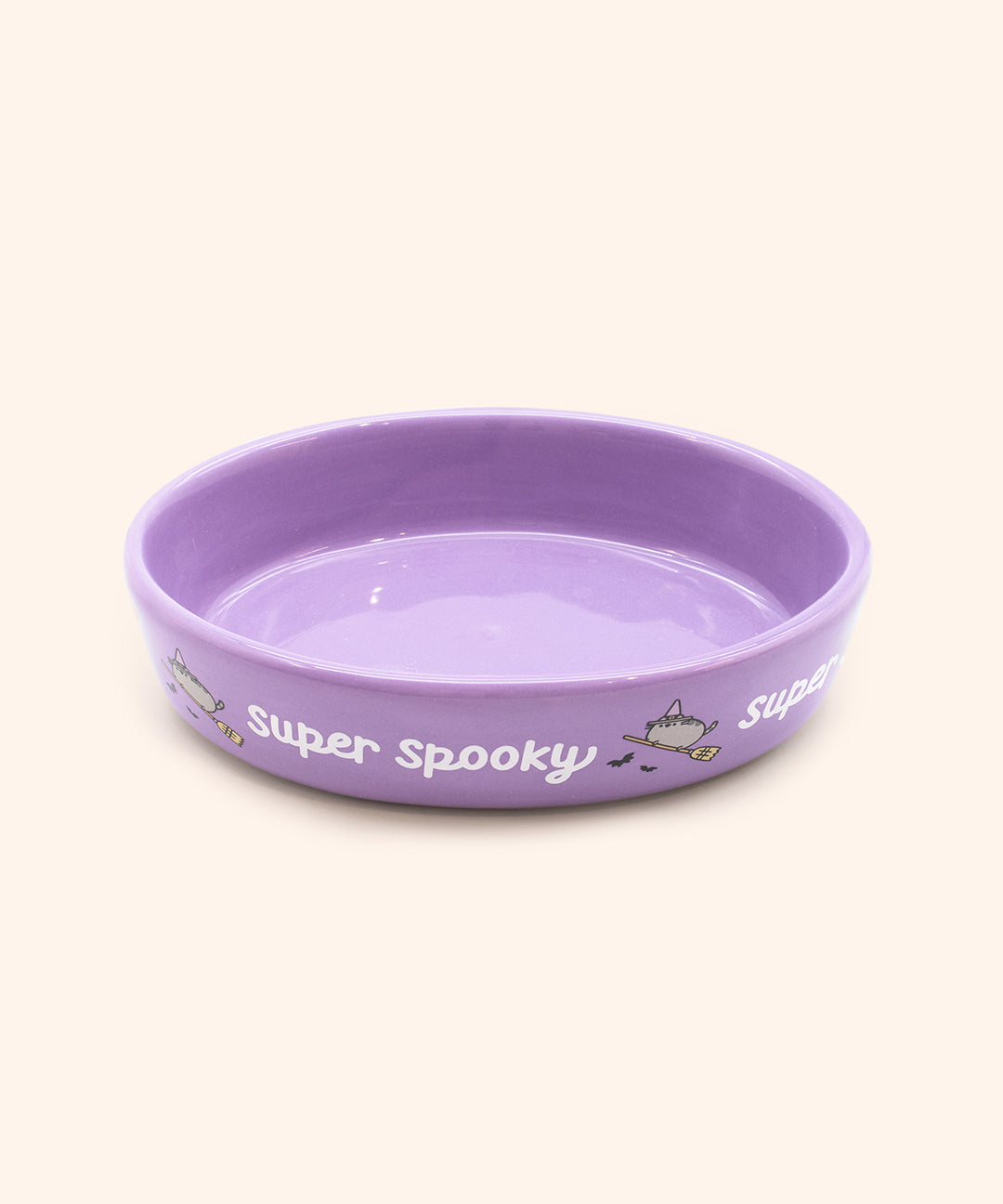 Aerial view of dark purple pet bowl showing that the interior purple color matches the exterior purple color of the oblong ceramic bowl.