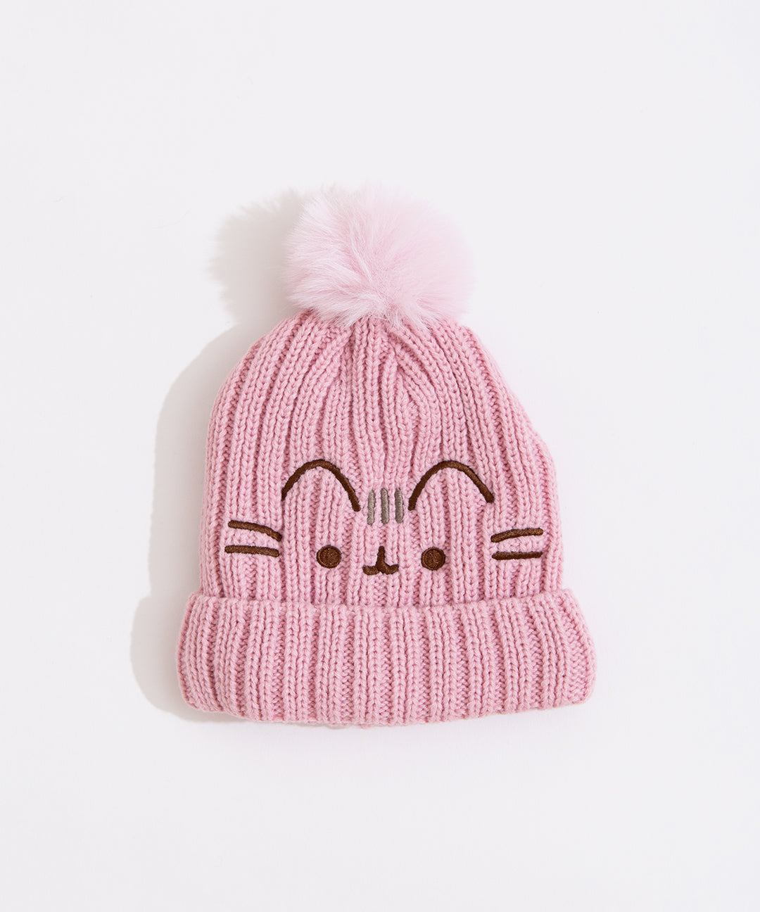 Front view of the Pusheen Pink Pom Knit beanie with Pusheen's facial features and ears embroidered in brown and her three head stripes are embroidered in gray. The hat lies on a white background.