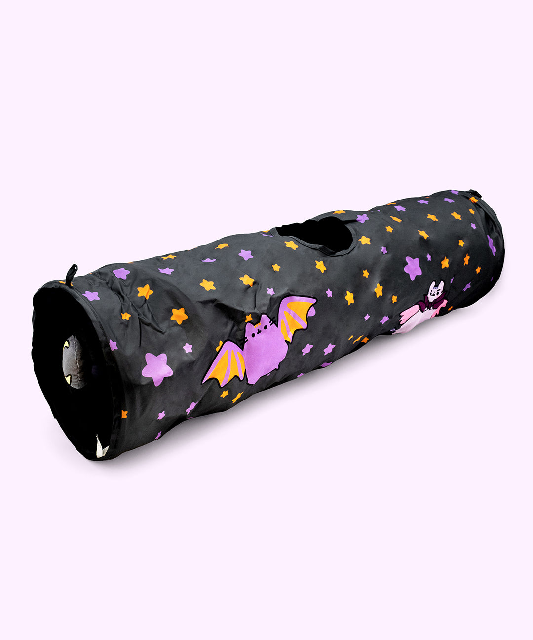 Full view of the Pusheen Pet Halloween Bat Collapsible Tunnel. The long tunnel has a rounded opening on both ends and a surprise circle opening in the top middle of the tube. One opening has a dangling plush of a crescent moon.