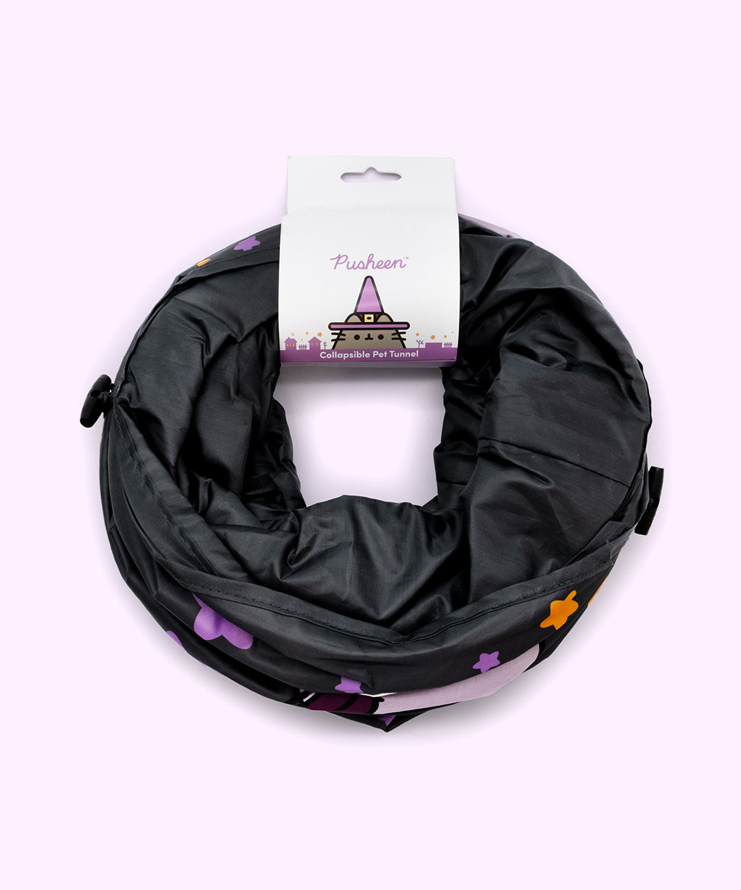 Collapsible Pet Tunnel in its packaging. The tunnel folds into a thin circle and is packaged with a purple label that says "Pusheen Collapsible Pet Tunnel."